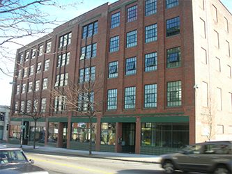 How Commercial Window Replacement Reduces Building Overhead